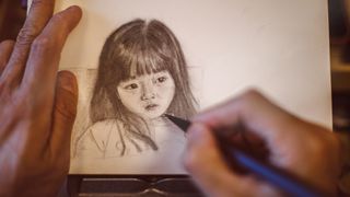Best mechanical pencils for drawing and writing; a person sketches a girl using a mechanical pencil