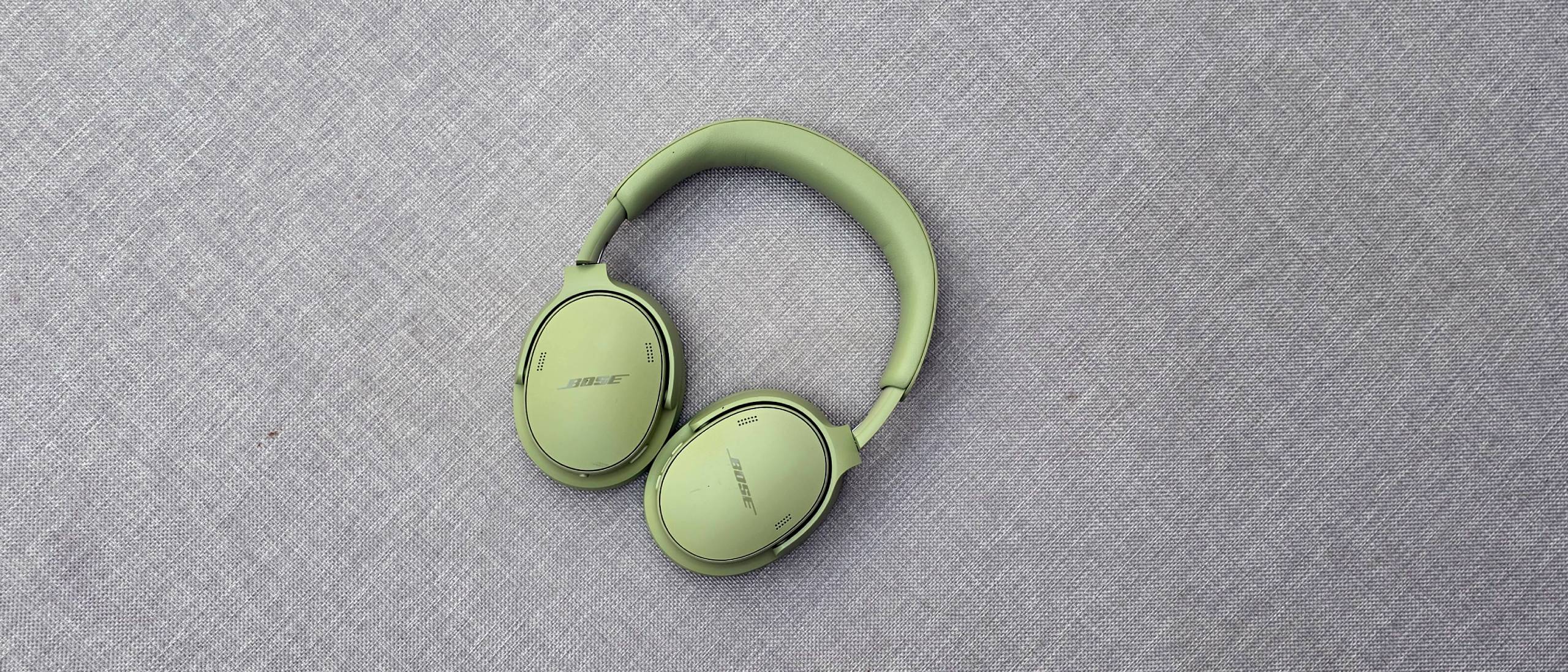 The Bose QuietComfort Headphones (2nd Gen) on a gray fabric.