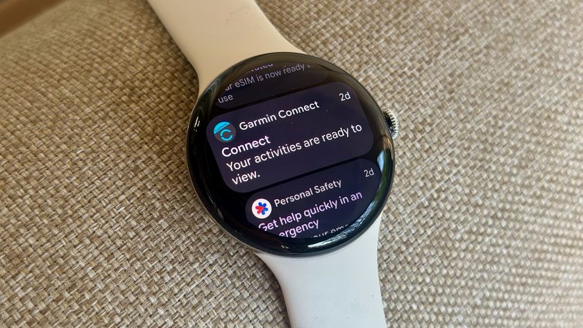 Notifications on the Google Pixel Watch 4 laying on a chair.