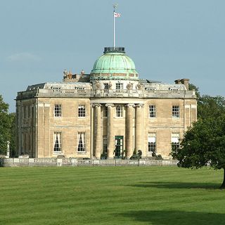 tyringham hall with dome windows green lawn and tree