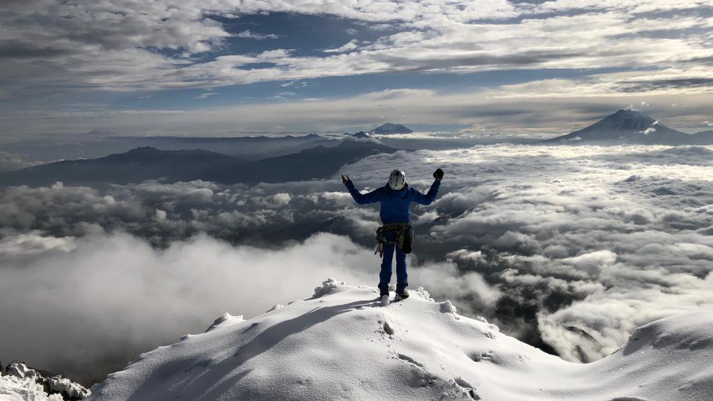 Karl Egloff summits a mountain