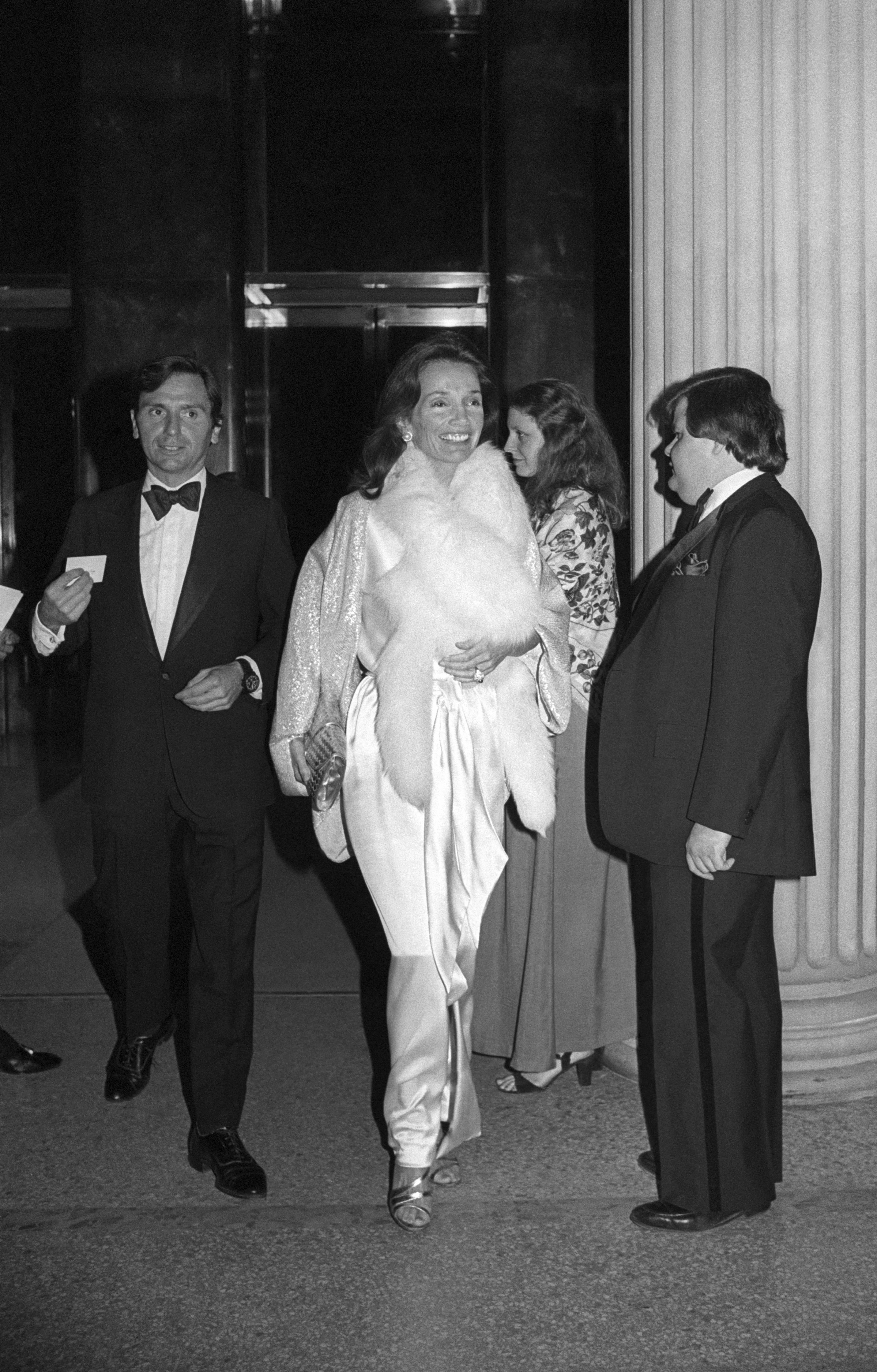 An image of Lee Radziwell wearing an opera coat attending the Met Gala in 1978.