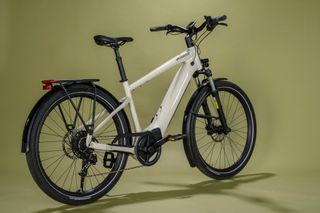 Specialized Turbo Vado 4.0 e-bike on an off yellow background