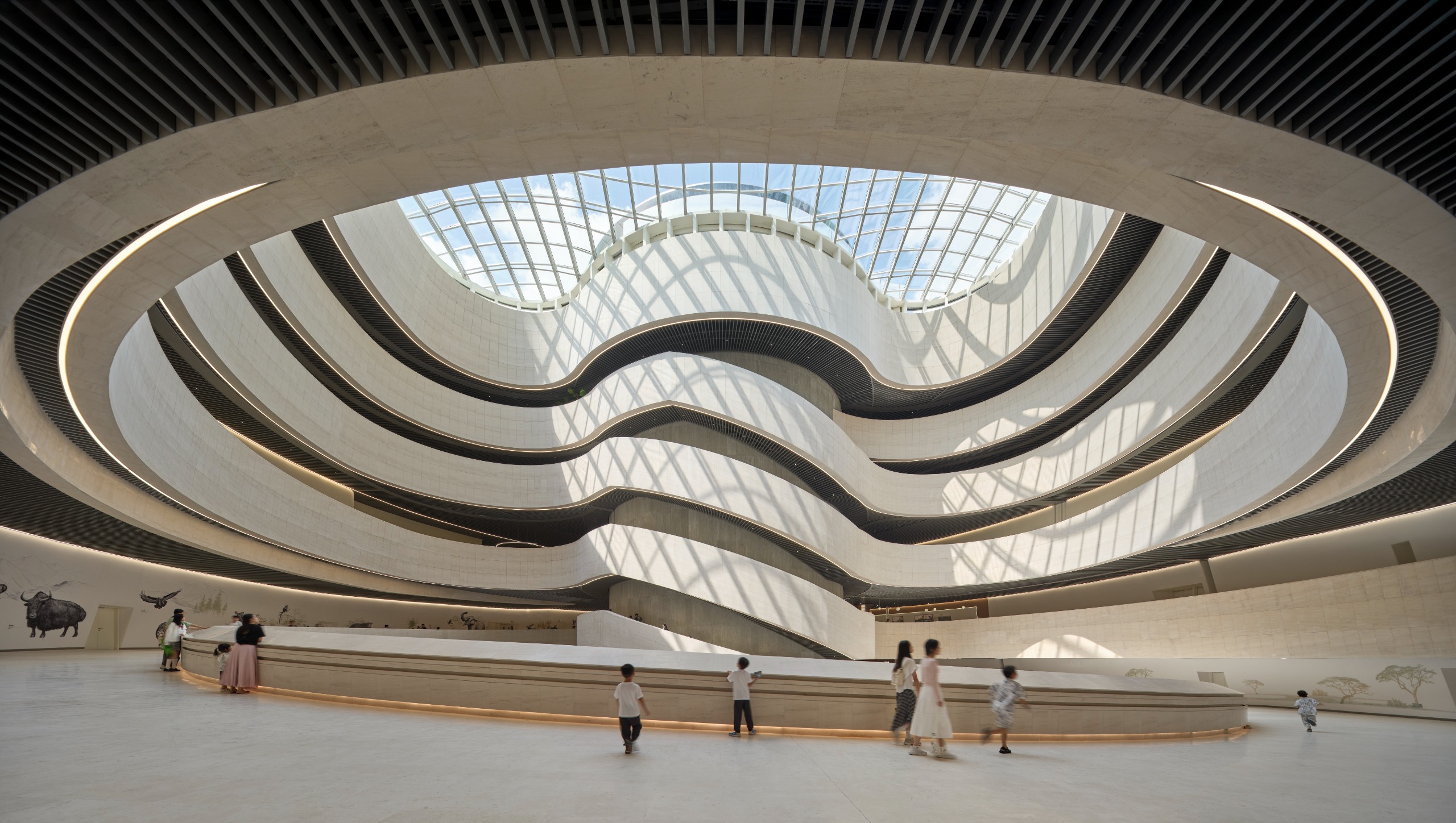 undulating forms of the Shenzhen Natural History Museum by 3XN, B+H Architects and Zhubo Design in a green park
