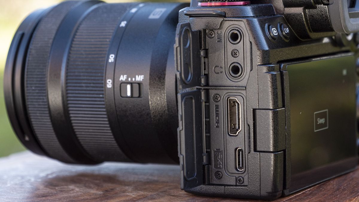Panasonic Lumix S5 II camera on a table with port doors open revealing full size hdmi port and others