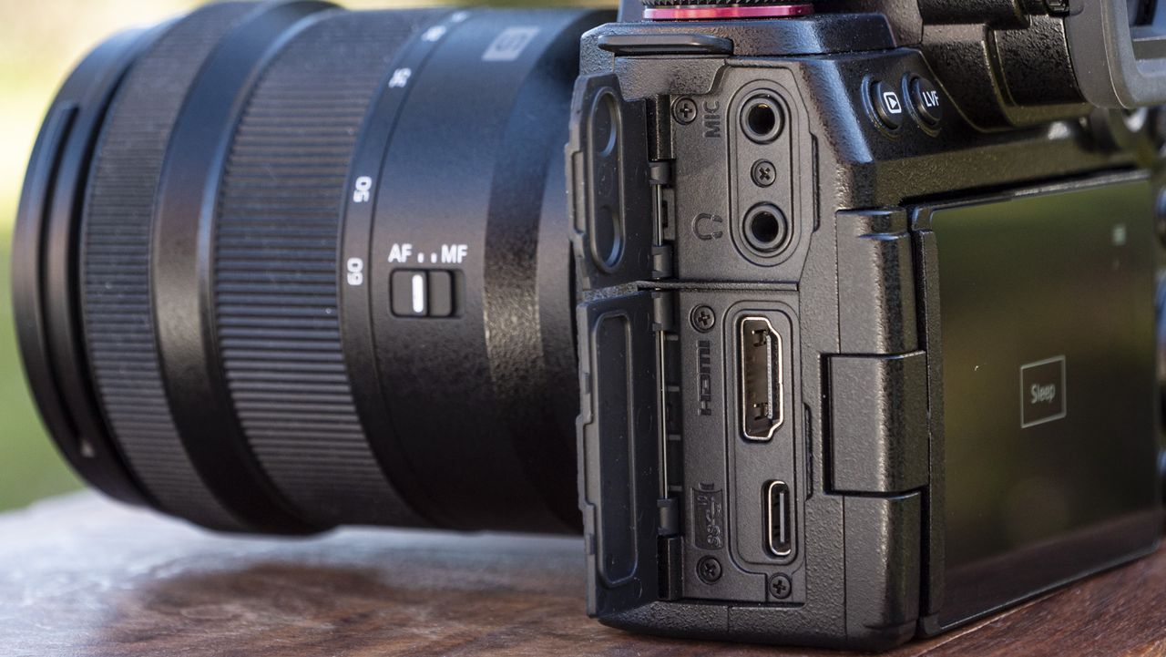 Panasonic Lumix S5 II camera on a table with port doors open revealing full size hdmi port and others