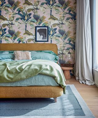 Floral feature wallpaper behind bed in modern bedroom