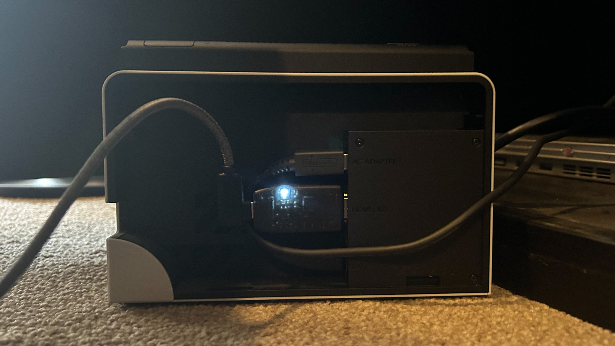 Genki ShadowCast plugged into the back of a Nintendo Switch dock