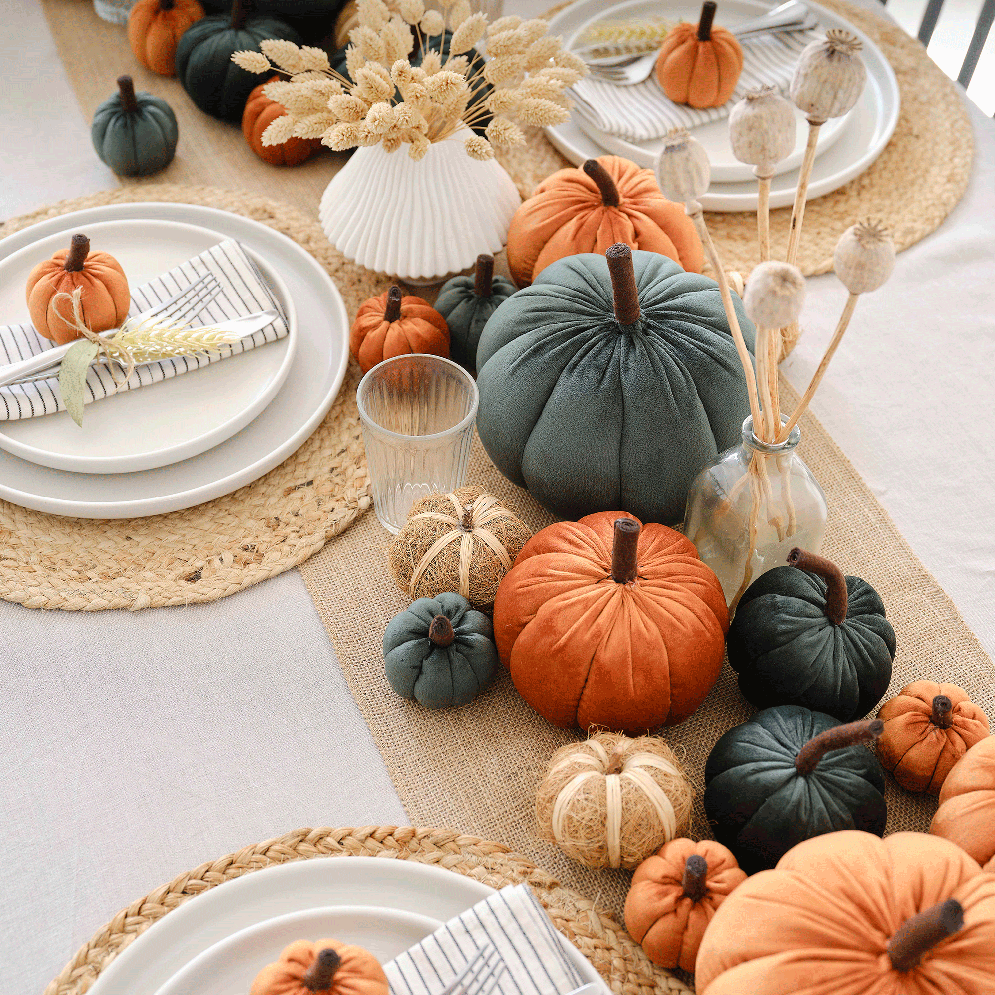 Orange and blue plush pumpkins on table