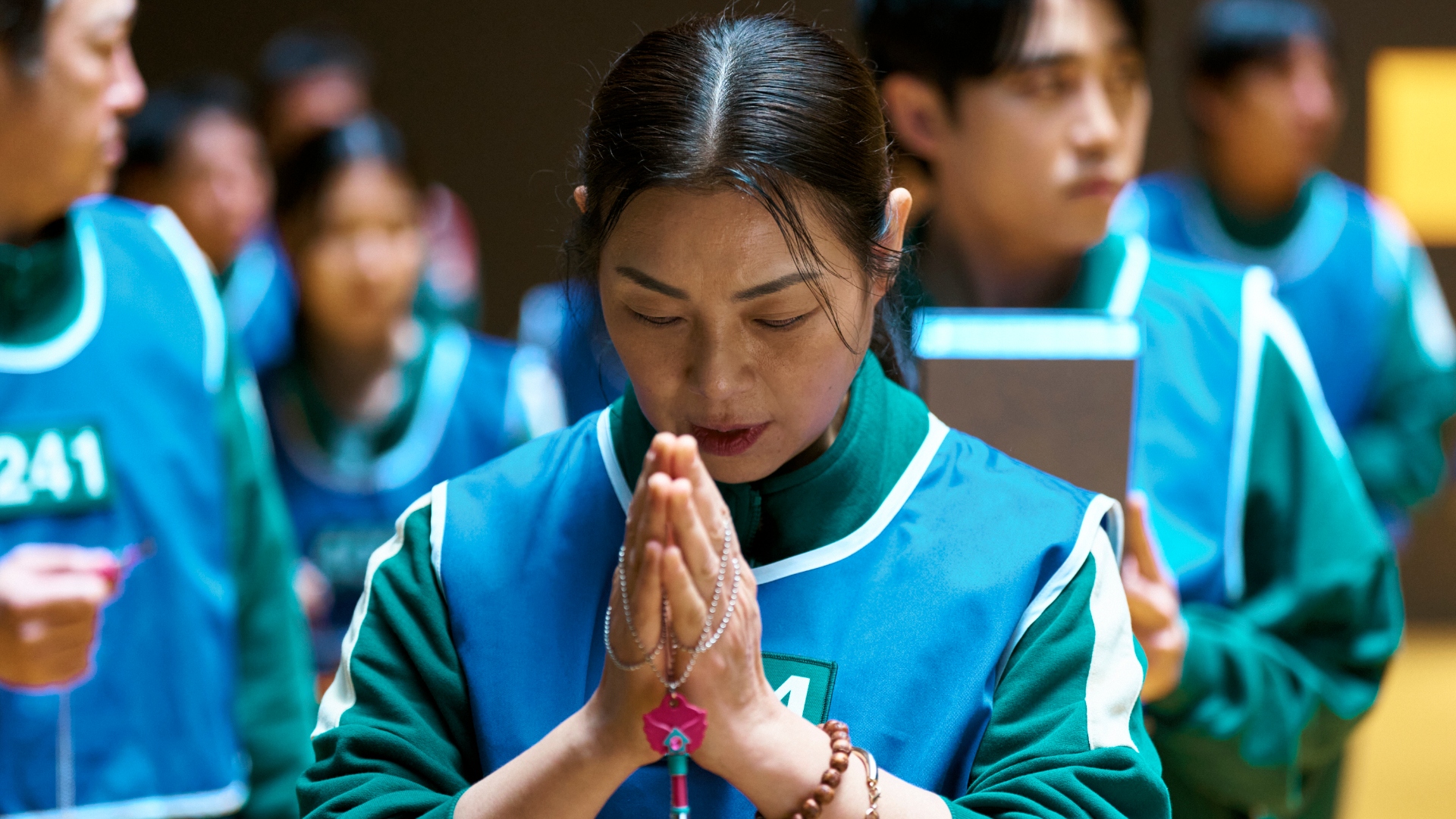 Player 044 prays in Squid Game season 3