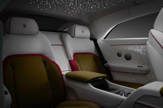 Rear seats of electric Rolls-Royce, with star-like lights in the interior