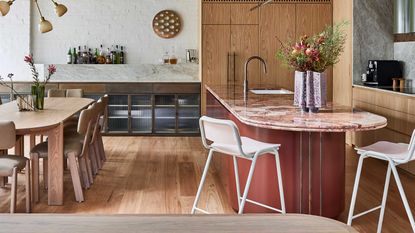 a kitchen with a red island