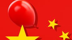 A red balloon against a background of the Chinese flag