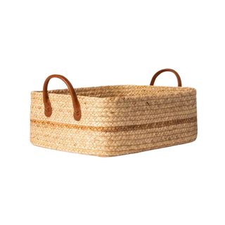 Woven basket with leather handles