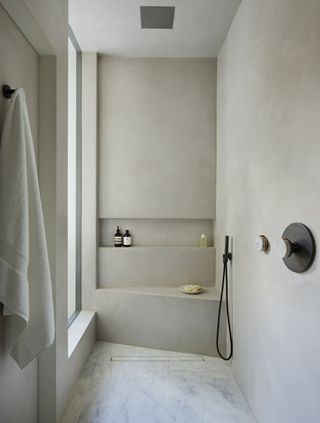 grey bathroom plaster on walls and ceiling