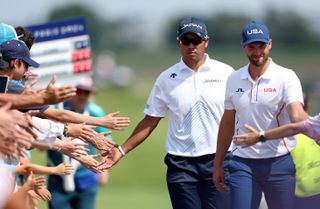 Wyndham Clark high-fives fans during the Paris 2024 men's Olympic golf tournament