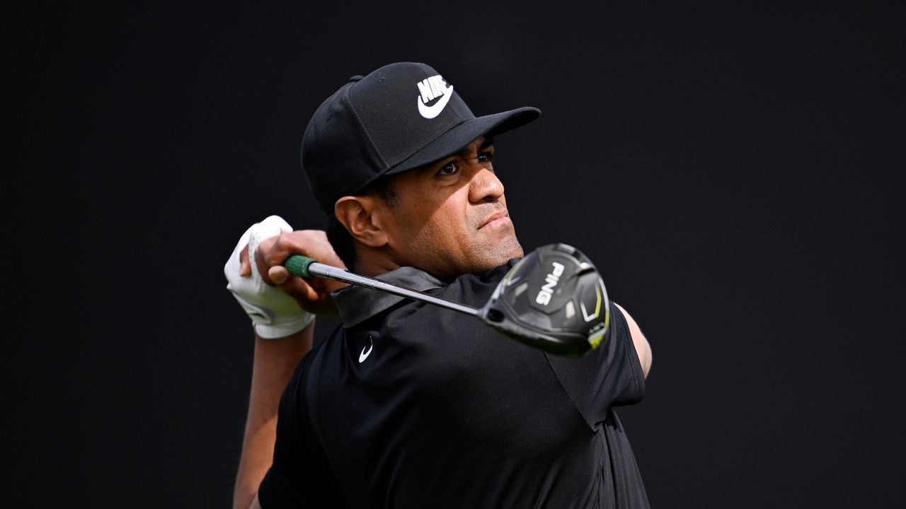 Tony Finau hits a driver at the 2025 Genesis Invitational against a black background