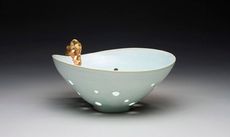 White bowl with gold design