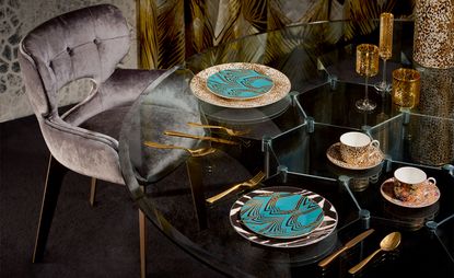 Patterned crockery on a glass table