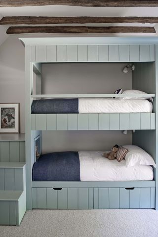 Baby blue wooden bunk beds with staircase, pull out draws under bottom bunk