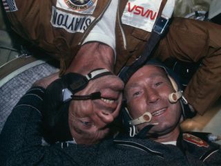 In 1975, Leonov participated in the Apollo-Soyuz Test Project, which became the first crewed international spaceflight. This image from the flight shows Leonov with NASA astronaut Deke Slayton.