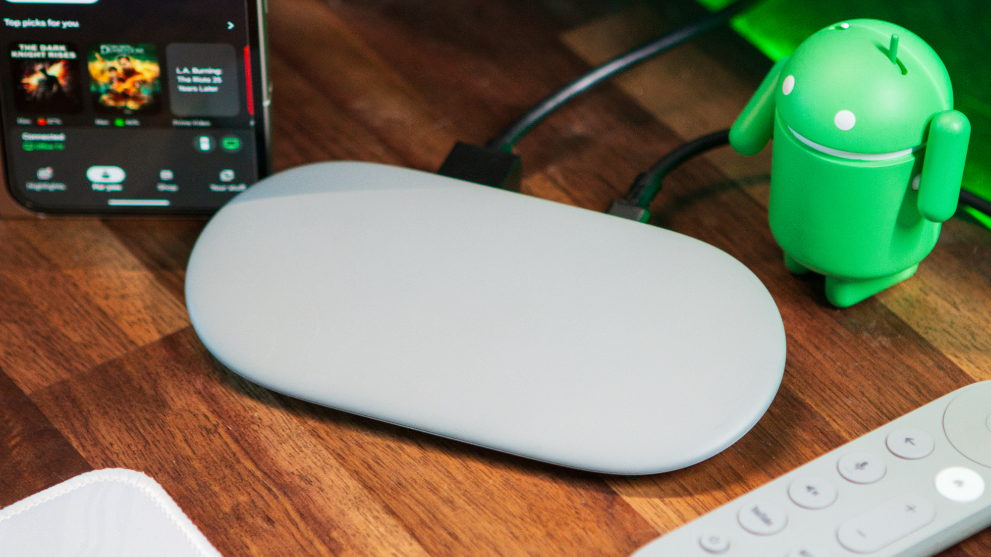Google TV Streamer with Android figure and remote