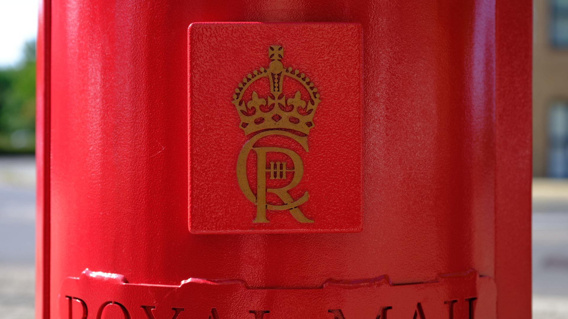 A photo of the first red post box with King Charles's III royal cypher, taken in 2024