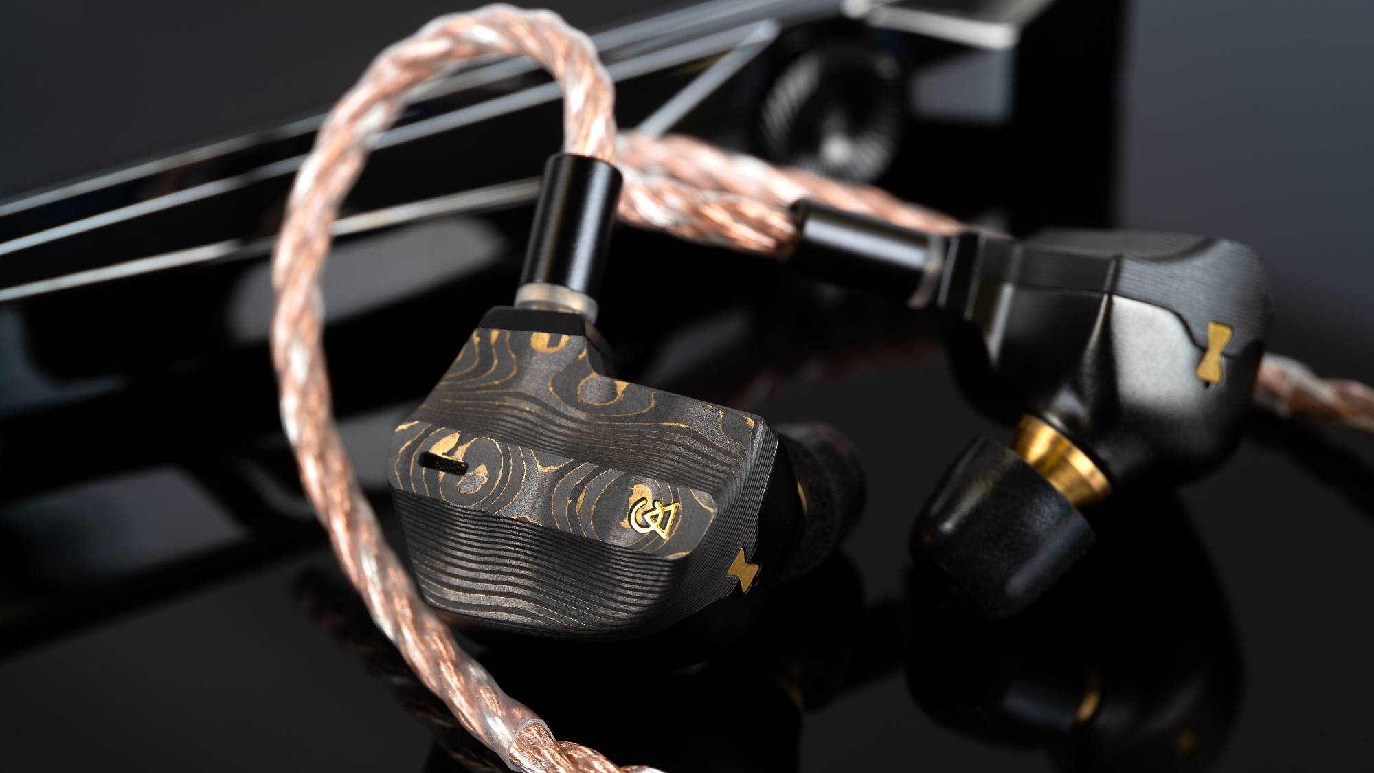 The Campfire Audio Chimera next to a digital audio player.