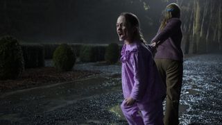 A young girl being pulled away shouting in the closing scene of 'The Haunting of Bly Manor'
