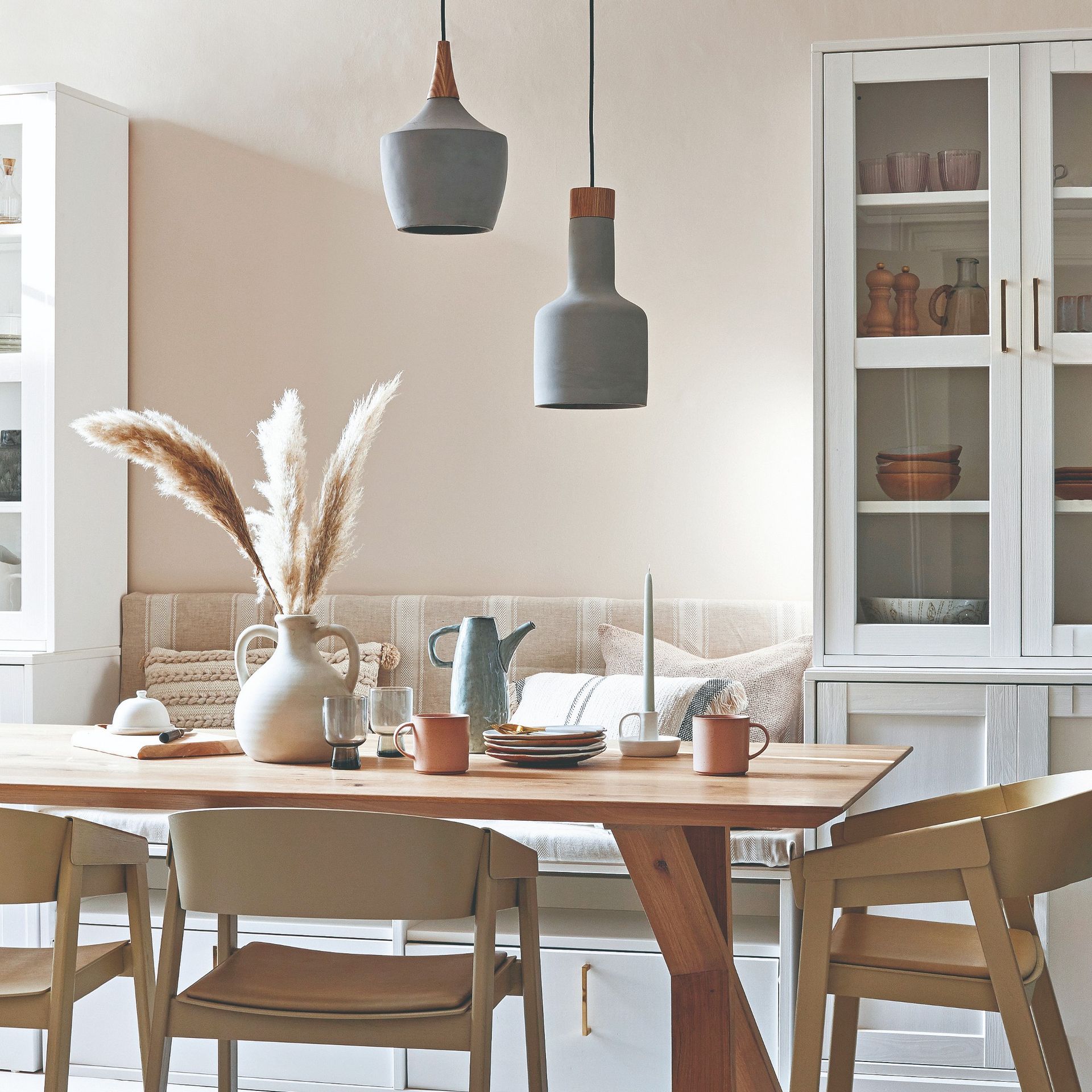 A dining room with pendant lights