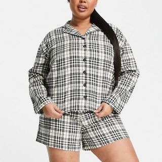 model wearing Wednesday's Girl Curve long sleeve pajama shirt and shorts set in vintage check