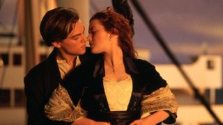 A press image of Jack and Rose standing together and about to kiss in Titanic