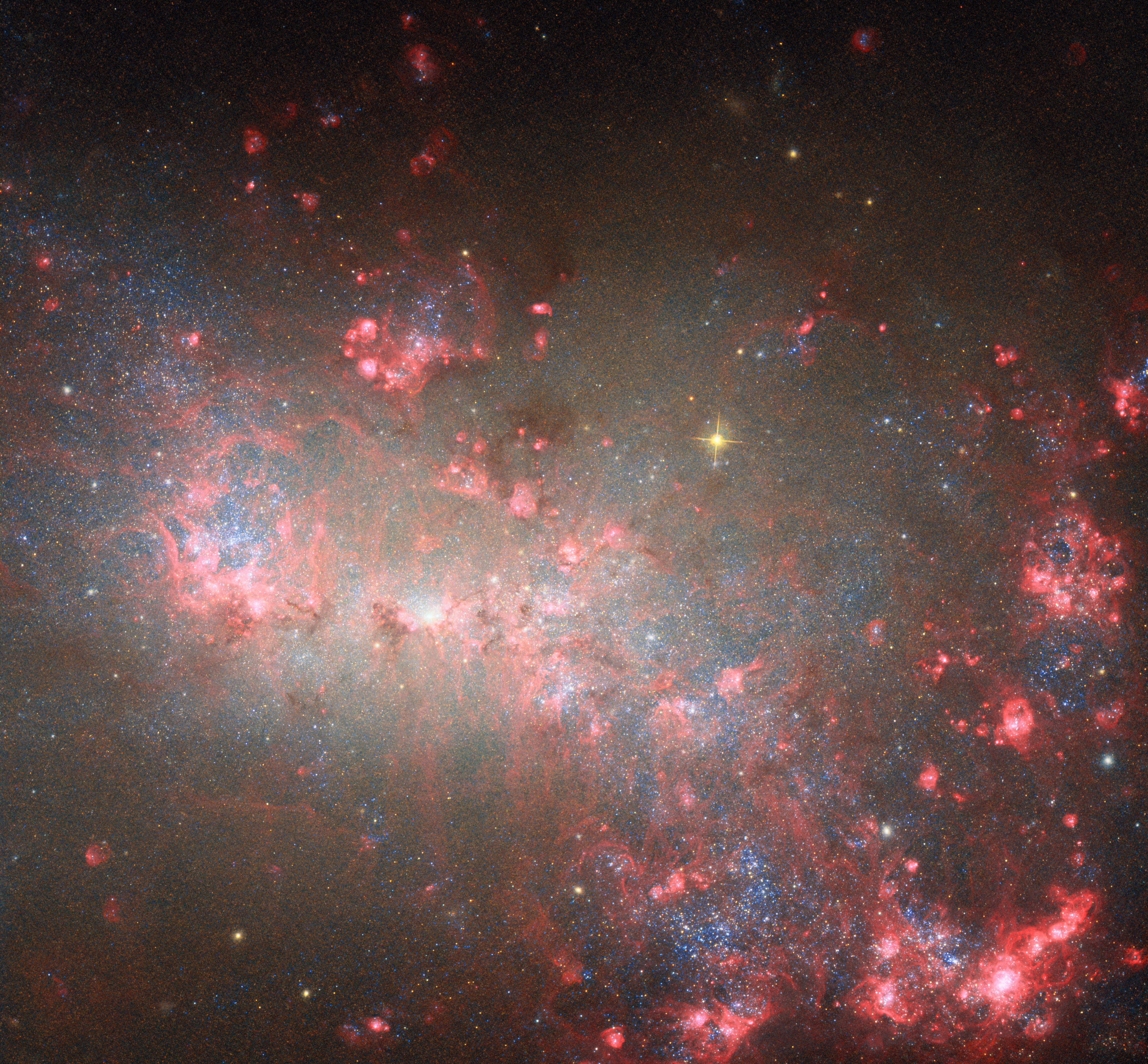 Clouds of red dust swirl around bright dots over a dark background