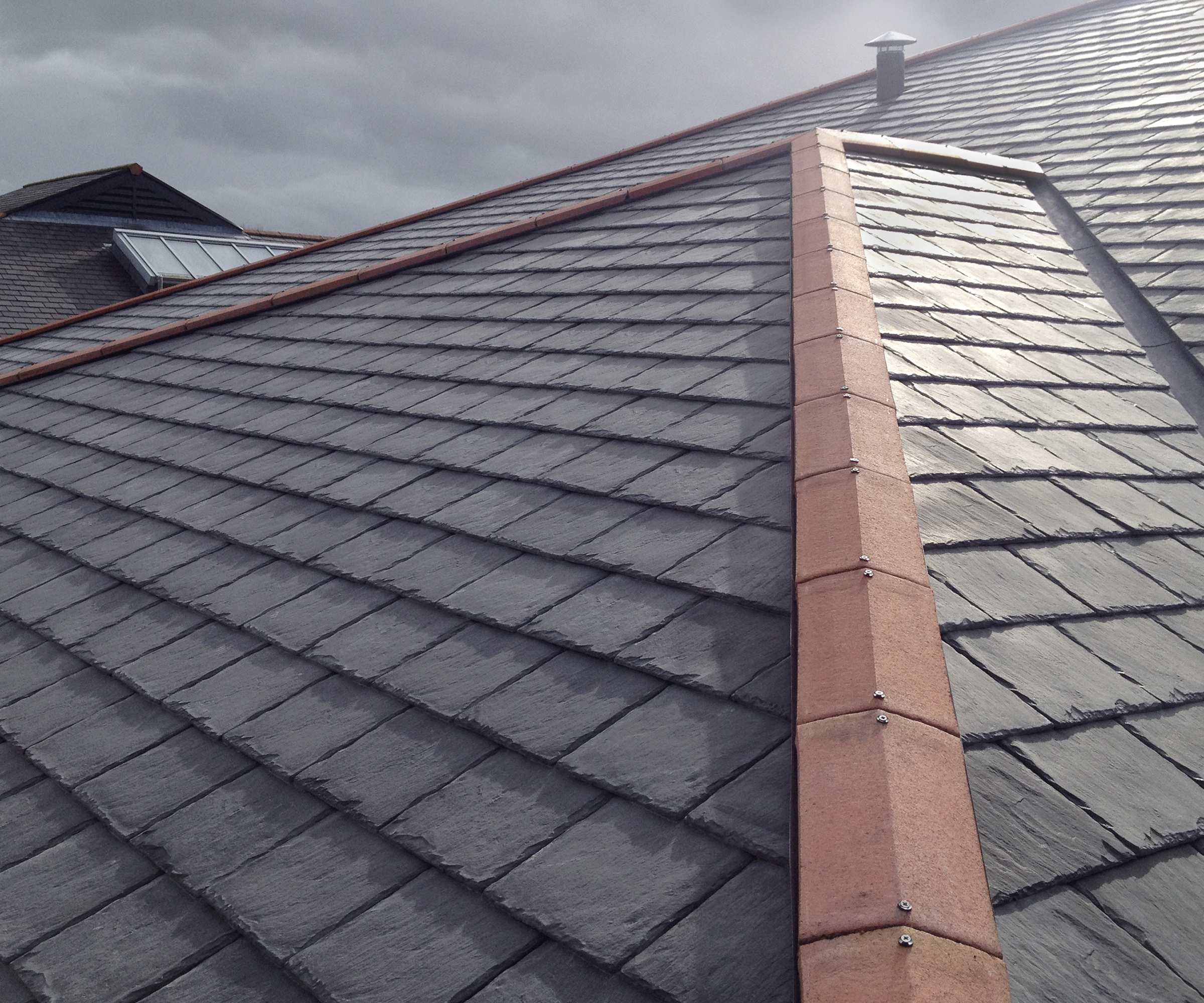 Closeup of a grey roof made using alternatives to natural slate