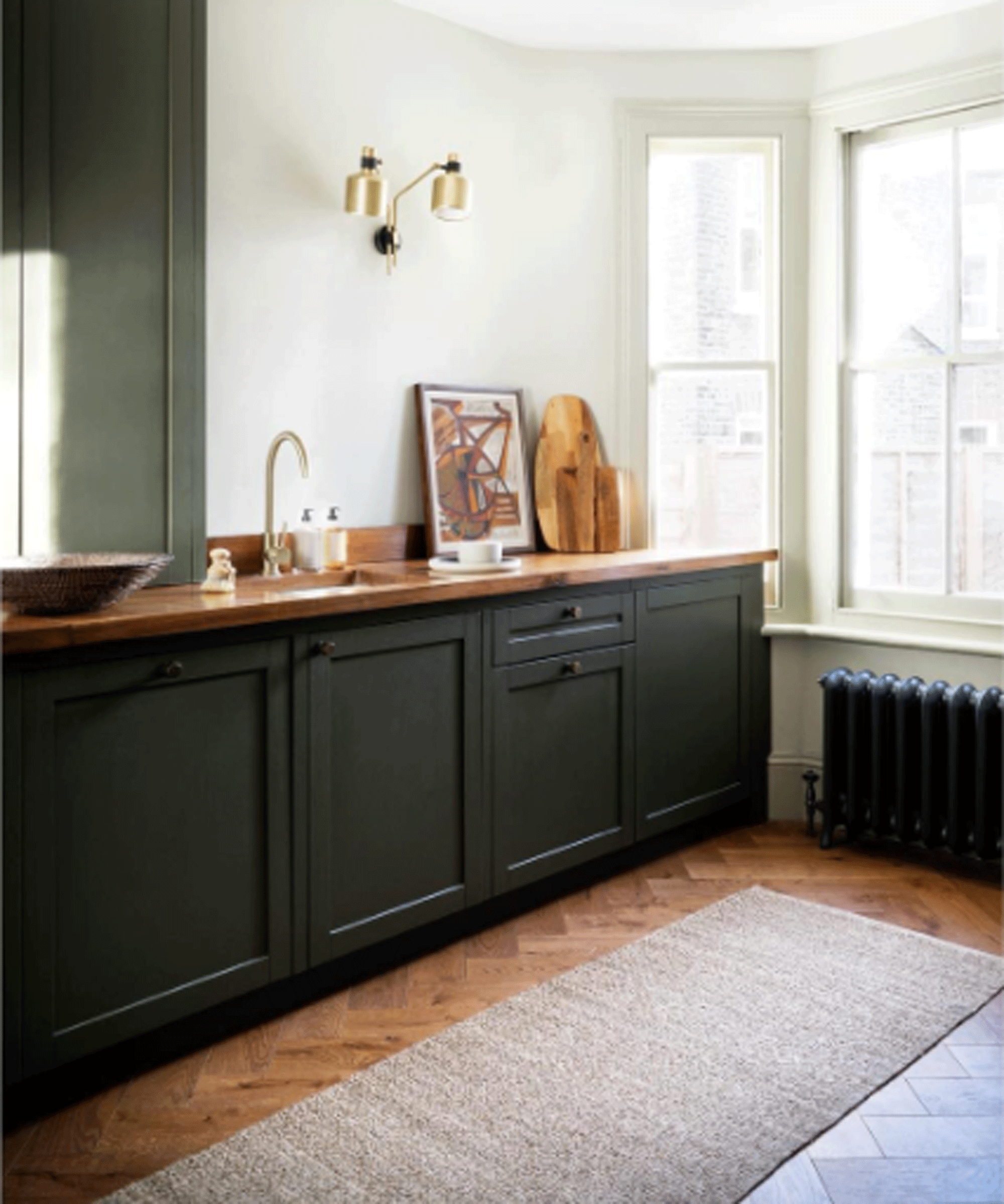 Dark kitchen with beige rug