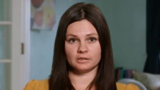 Julia looking at the camera during her confessional