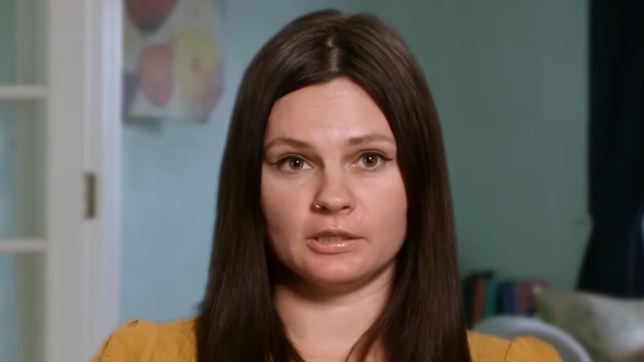 Julia looking at the camera during her confessional