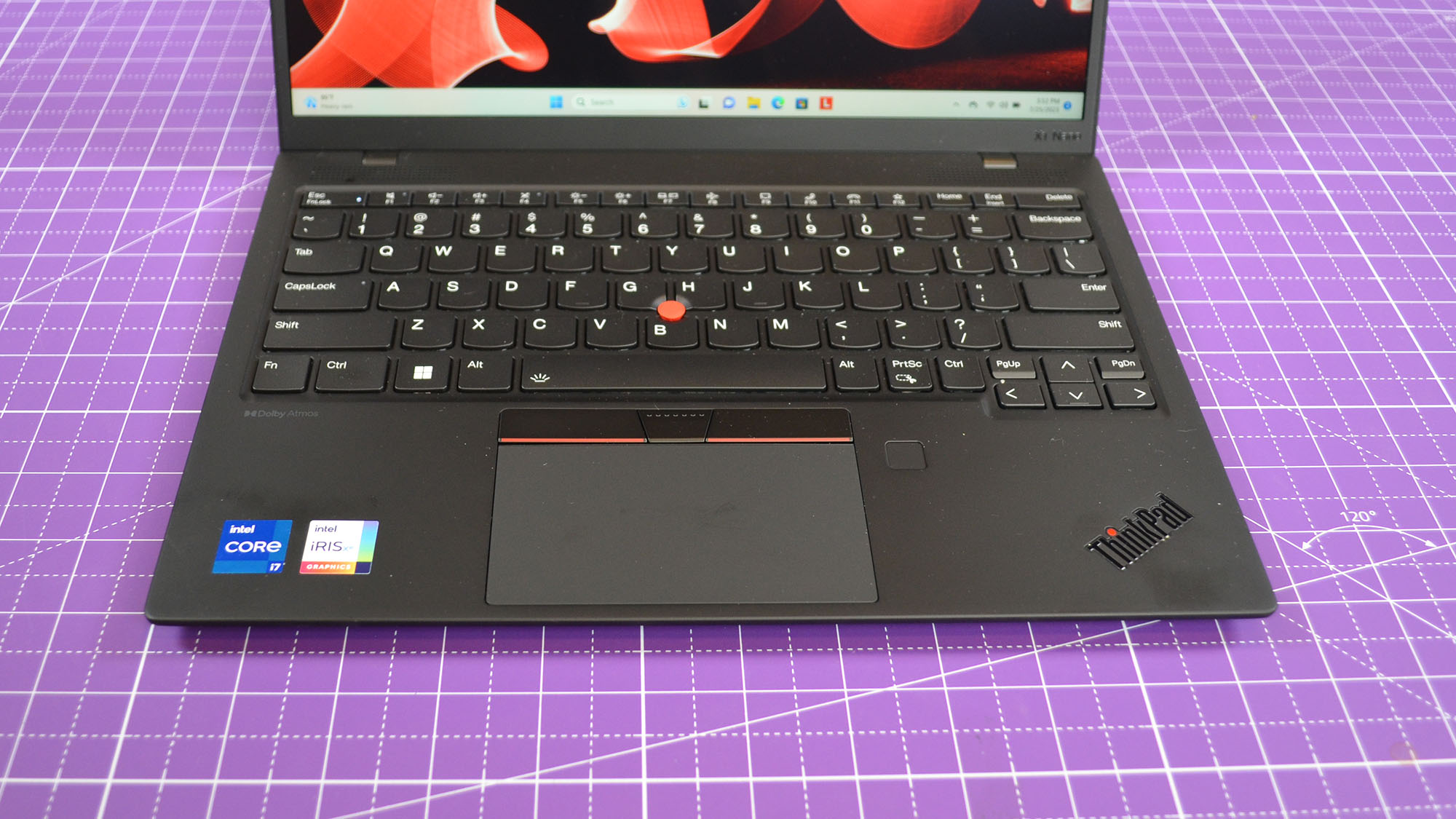 A Lenovo ThinkPad X1 Nano Gen 3 on a desk with a purple desk mat