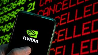 Nvidia logo on phone in front stock ticker.