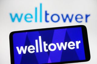 Welltower logo on smartphone with logo blurred in background too