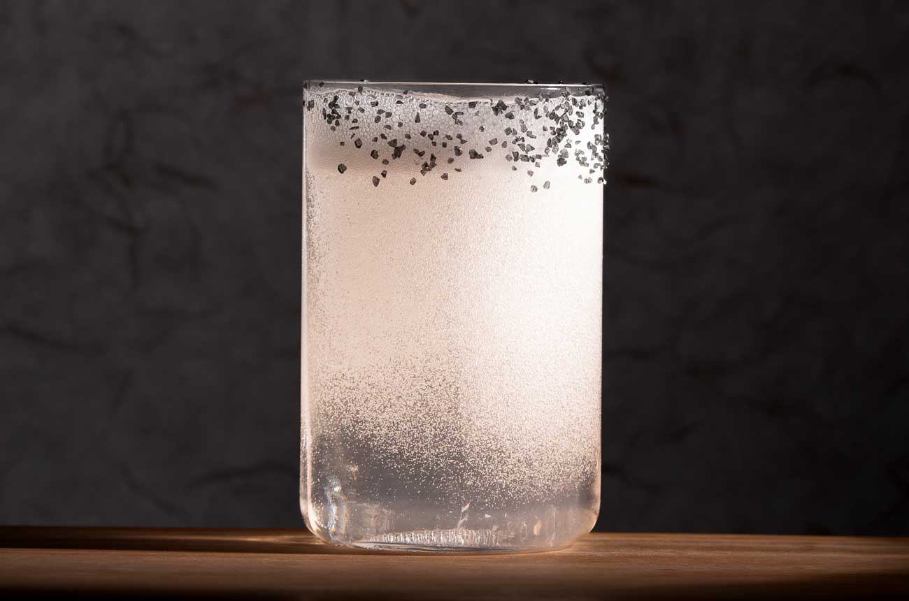 A white cocktail in a glass