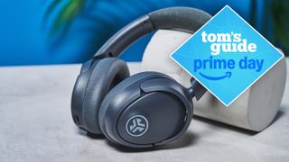 the jlab jbuds lux anc headphones in black with a tom's guide deal badge 