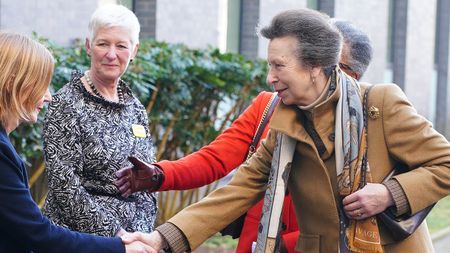 Princess Anne, wearing a camel coat, is greeted by Maria Kane, the Joint Chief Executive of North Bristol NHS Trust and University Hospitals Bristol and Weston NHS Foundation Trust