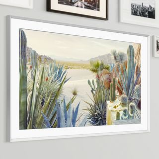 silver framed tv picture frame on gallery wall