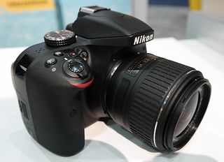 The new D3300 boasts a much smaller lens and beefed up internals.
