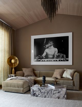 beige living room with beige velvet sofa by K Interiors