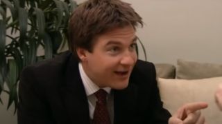 Jason Bateman in a suit, speaking to someone on Arrested Development