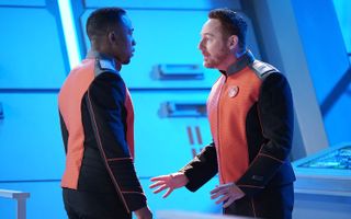 Lt Malloy (Scott Grimes) begs Lt Cmdr LaMarr (J Lee) for advice on how to ask a girl out, since he doesn't have a partner to take to the Ja'loja ceremony on Moclus
