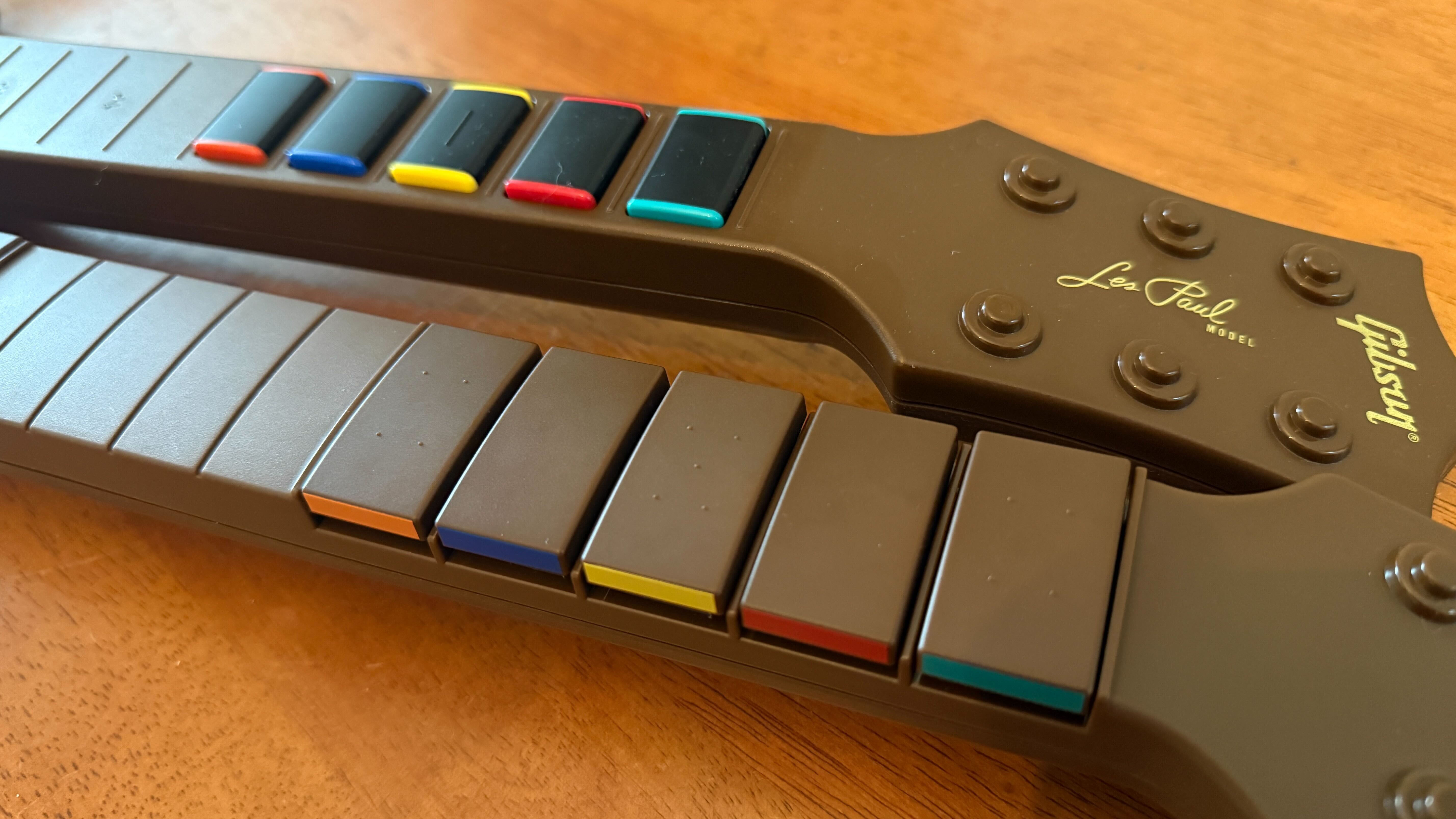 The difference in fret buttons on the CRKD Gibson Les Paul controller