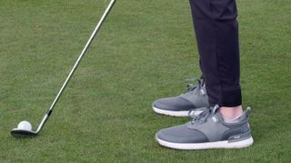 Dan Parker hitting a wedge on course wearing the True Linkswear Lux Hybrid golf shoe